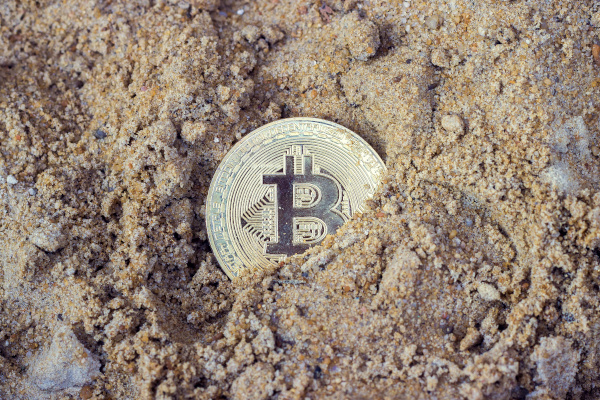 dirty bitcoin in sand